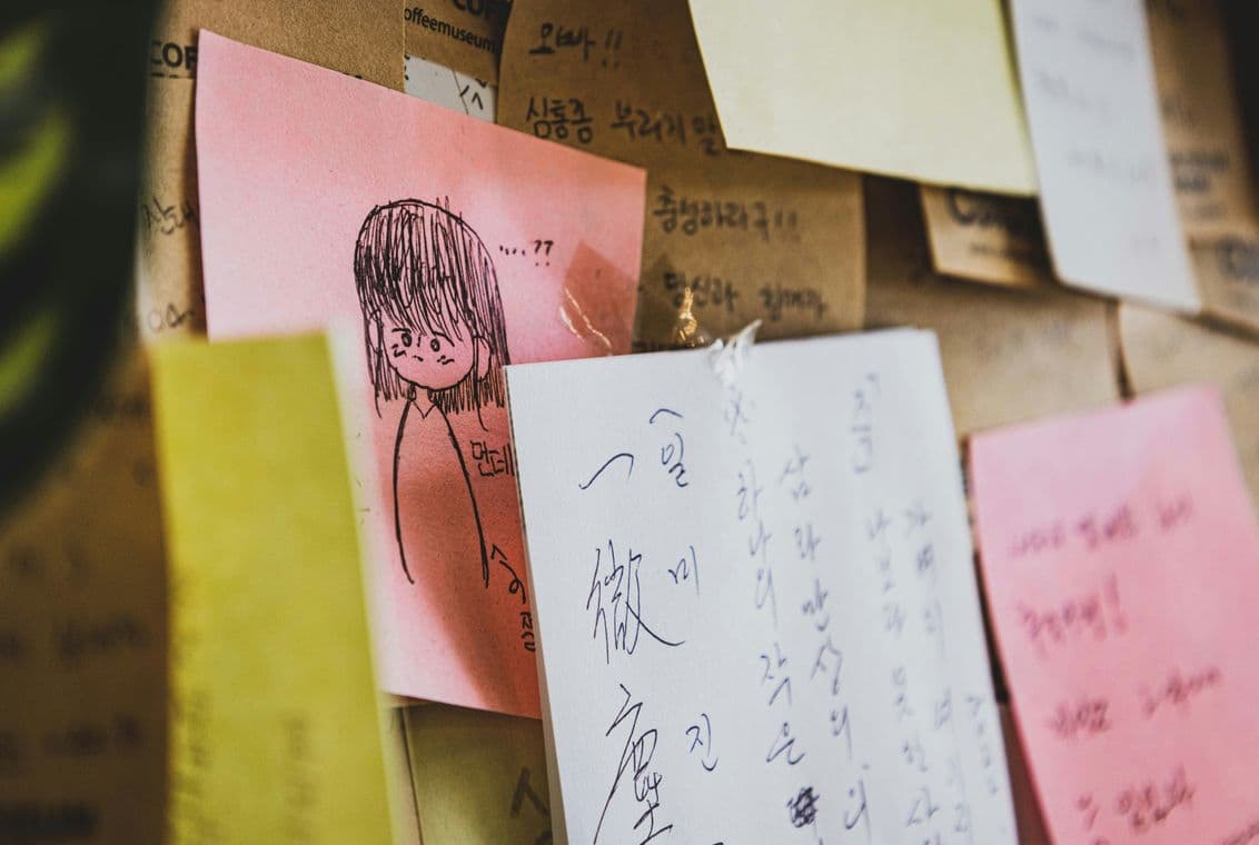 Illustrated sticky notes depicting creative process